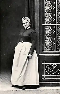 Woman standing in shopfront