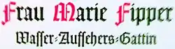 Detail of a memorial in Munich, Germany, showing the text Wasser-Aufsehers-Gattin ('water attendant's wife') containing a long s adjacent to an f