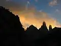 The twin peaks of Mashanig. The fallen pillar bridging the peaks is called "Mishifo". The left-hand tower is the highest point of the range.