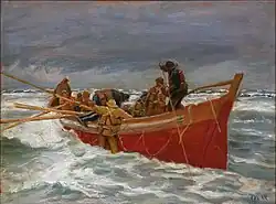 The red lifeboat on its way out to the sea