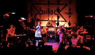 A picture of the band MoeTar playing some amazing rock music