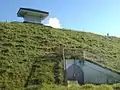 Showing the water reservoir installations at the top of the mountain.
