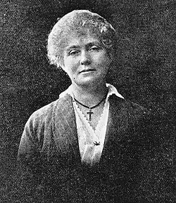 black and white photograph of a woman looking directly at the camera