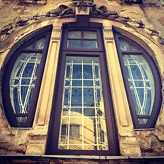 Mixed with Art Nouveau – Stained glass window of the Romulus Porescu House, decorated with lotus flowers, Bucharest, Romania, 1905, by Dimitrie Maimarolu[25]