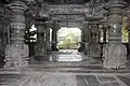 Ornate mantapa (hall) and lathe turned pillars with decorative base containing relief