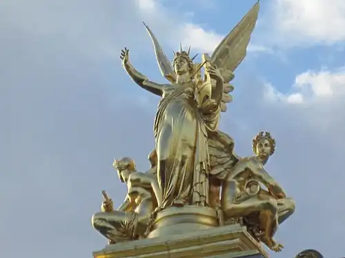 Gumery's L'Harmonie (1869), atop the left avant-corps of the façade, is 7.5 metres (25&nbsp;ft) of gilt copper electrotype