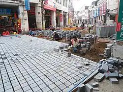 Image 21Replacing the old road with cobblestones of cement in Bo'ao Road area, Haikou City, Hainan, China. (from Roadworks)