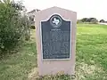 Historic marker at site of a former hotel