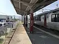 View of Platform 1 looking west, in the direction of Haiki. Note there is a siding branching off the track.