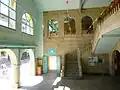 Entrance and central interior staircase.