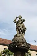 Statue of the Roman goddess Fama crowning the fountain in the square