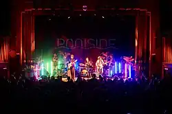 Poolside performing in 2024