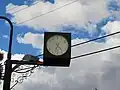 R.S.L. clock, Jandowea, Queensland, Australia. Numbers on the clock face are replaced by the words "Lest we forget".
