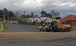 Image 33A road being resurfaced using a road roller (from Road surface)
