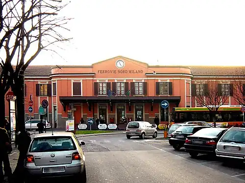 Square two-story building with hip roof