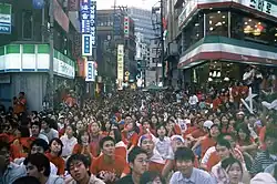 Young people watching the 2002 FIFA World Cup