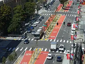 View of an urban arterial with a bus on the red center lanes