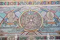 Soyombo and several Buddhist, Tengrist, and Chinese zodiac symbols in a wall mosaic.