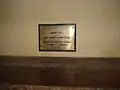 A sign indicating where the remains of the prophets John the Baptist and Elisha the Prophet are kept just below.