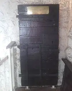 The cell door from the Bocardo Prison preserved in the tower of St Michael at the North Gate, Oxford.