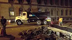 Image 22Construction crew laying down asphalt over fiber-optic trench, in New York City (from Road surface)
