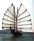 The bedar Naga Pelangi 45'/13.7 m (LOD) sailing wing to wing near Pulau Perhentian off the Terengganu coast, 1998