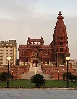 Historic palace with distinctive Indo-Cambodian architecture featuring ornate spires and decorative facades