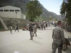Combined Joint Task Force 82nd Soldiers and logistics units walk the Torkham border crossing area with CENTCOM Deployment and Distribution Operations Center Director, U.S. Air Force Maj. Gen. Robert McMahon, March 25, 2010, Torkham, Afghanistan.
