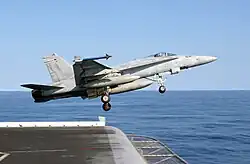 NF-414 launches from the Kitty Hawk on 31 Jan 2003 in the Sea of Japan.