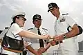 Captain Jeff Bartkoski of USS Blue Ridge presents a command coin to Sanming on 28 June 2006