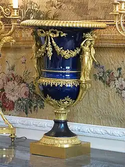 Louis XVI style caryatids on the Médicis Vase, by Louis-Simon Boizot, Pierre Philippe-Thomire and the Sèvres Porcelain Manufactory, c.1787, porcelain and gilded bronze, Louvre[24]