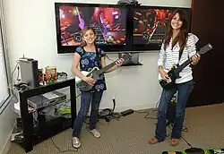 Image 79Aria Wallace and Victoria Justice playing Guitar Hero (from 2000s in video games)