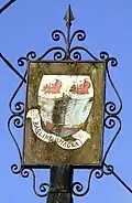 The battered old village sign of Barling.