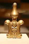 Lime container; 5th-9th century; gold; 23&nbsp;cm (9&nbsp;in) high; Metropolitan Museum of Art (New York City). Likely used by a member of the Quimbaya elite