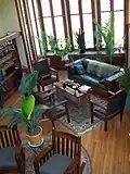 Living room with two-story bay window