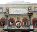 Villa Venezia's facade representing two of his sons: Osvald and Walter. In the middle a damaged statue of Albrecht Dürer is recognisable.