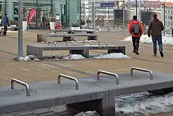 Benches with metal pipes to prevent lying down at a train station in Vienna
