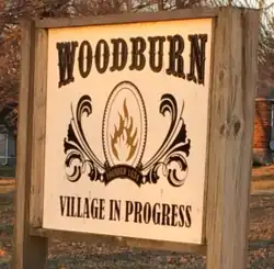 Sign in the public square of Woodburn, Illinois.