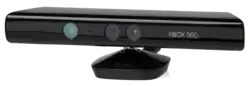 A long, black plastic tube with a stand on its bottom and sensors arrayed along its front. The Xbox 360 brand is displayed next to the sensors.